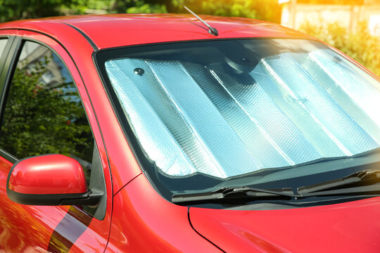 Sun shade under windshield in car, closeup. Heat protection