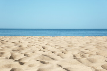 Fototapeta na wymiar Beautiful sandy beach and sea on sunny day. Summer vacation