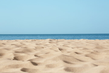 Fototapeta na wymiar Beautiful sandy beach and sea on sunny day. Summer vacation