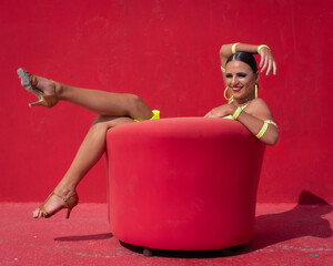 Ballroom Latin Dancer Posing in Front of a Red Background
