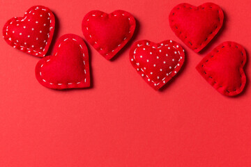 Top view of textile hearts on colorful background. Valentine's day concept with copy space