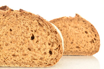 Two halves of a loaf, fragrant buckwheat bread, close-up, isolated on white.