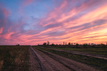 the road beyond the horizon into the sunset