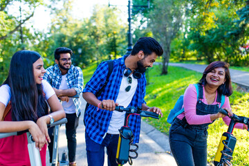 indian ethnicity friendship togetherness in park on sunny day