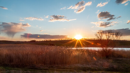 sunrise over the hill, sun rays © Samarskyi Serhii