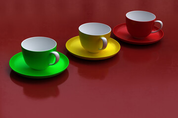 Cups and saucers of different colors on a red background
