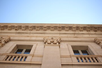 Old Ornate Beige Historic Building Against Blue Sky
