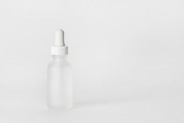 Hyaluronic acid bottle on a light background..