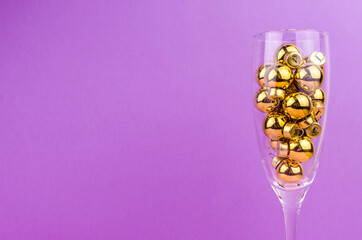 a glass of champagne with balls