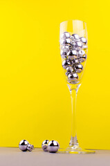 a glass of champagne with balls