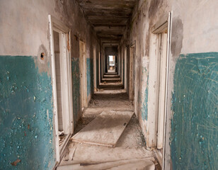 Empty corridor in former military base abandoned after regime collapse