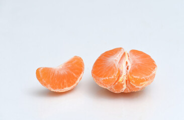 Peeled tangerine on white background