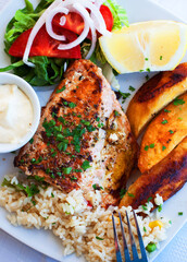 Greece food - Grilled salmon and vegetables on white plate