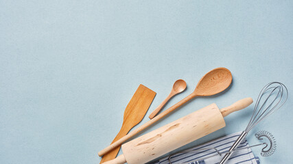 Lots of wooden kitchen utensils for baking