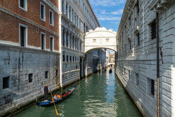 Fototapeta na wymiar VENICE, ITALY - 07 November 2015: Image with Gondolas at Bridge oh Sights in Venice. Ponte dei Sospiri, medieval mediterranean landmark of Italy