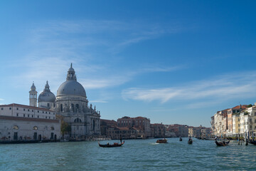 Venice, Italy, 07 November 2015, the Grand canal, the Cathedral of Santa Maria della Salute and gondolas with tourists