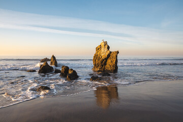 Sea stacks in Pacific Ocean on a sunny day at El Matador State Beach in Malibu, California