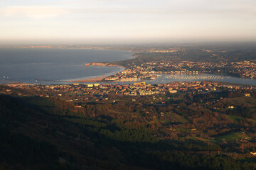 View from Txingudi bay with the mouth of Bidasoa river between Irun, Hondarribia and Hendaia at the Basque Country.	
