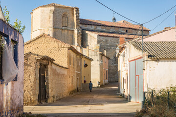 Fototapeta na wymiar San Juan street passing by the church in Castrillo Mota de Judios village, province of Burgos, Castile and Leon, Spain