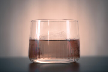 Whisky in a rocks glass with a large ice cube
