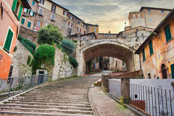 Fototapeta na wymiar Perugia, via the aqueduct ancient brick arch construction where water flows in the 12th century