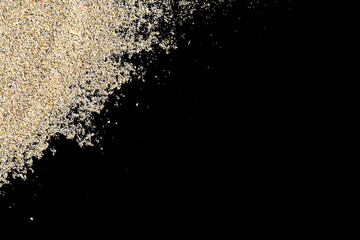Obraz na płótnie Canvas Desert pile sand isolated on black. Dust heap beach texture on shore background. Travel concept in minimal style.