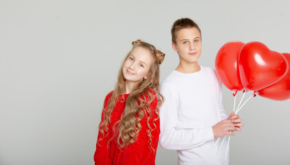 Cute couple in love with schoolchildren on Valentine's Day