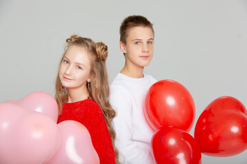 Cute couple in love with schoolchildren on Valentine's Day