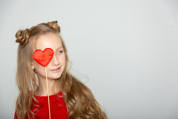 Cute teen girl with hearts on Valentine's Day