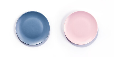 Empty Matte Navy Blue and Pink Plates isolated on white background top view