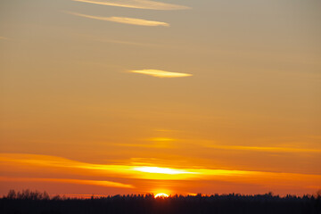 sky landscape, winter clouds with a setting orange sun