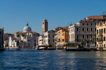 Fototapeta na wymiar Venice, Italy 07 November 2015. View of the Grand Canal, gondola with tourists, Chiesa di San Geremia