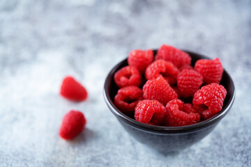 Fresh ripe Raspberries on a dark background