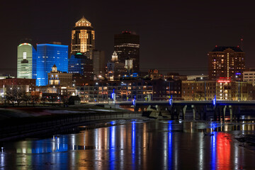 Reflections of the Des Moines Skyline in the Des Moines River at night.
