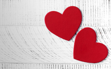 Valentine's Day background. Two hearts on a wooden background. Copy space.