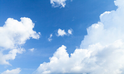 Naklejka na ściany i meble Blue sky with white cumulus clouds at daytime