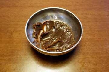 Chocolate for brigadeiro in a stainless steel bowl. Typical Brazilian sweet home made.