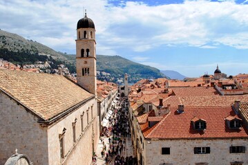 Fototapeta premium Dubrovnik, Croatia: A crowded pedestrian street. Dubrovnik is a filming location for a popular TV series and cruise port. Some fear that over tourism will ruin the old world charm. 