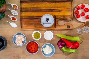 Vegetables, spices with kitchen bowls around photographed from above