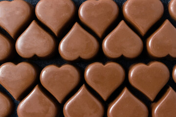 Chocolate hearts close up. Festive background for Valentine's Day. Selective focus.