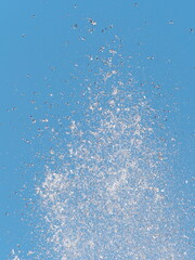 Tokyo,Japan-January 2, 2021: Splash of water on blue sky backgournd
