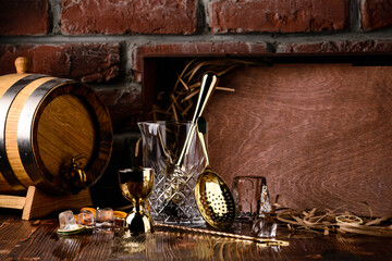 Fototapeta na wymiar Set of bar or pub accessories with martini cocktail shaker. Set for the bartender Bar spoon, jiger, strainer