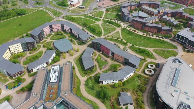 Aerial footage of the large university buildings known as Constantine College in the City of York in North Yorkshire in the UK showing the main buildings and campus