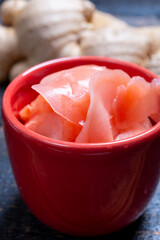 Asian food, pink sliced pickled ginger roots ready to eat