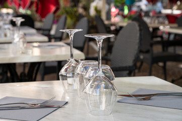 Before lunch time, empty stylish cafes with served tables waiting for guests in Saint-Tropez, Provence, France