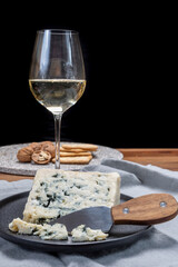 Cheese and wine pairing, french soft blue roquefort cheese and sweet white sauternes wine from Bordeaux, France