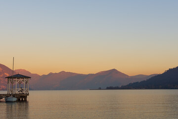 Fototapeta na wymiar sunset over the quiet waters of Lake Iseo