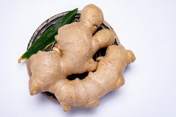 Fresh ginger rhizome root used in traditional medicines and for flavoring meals isolated on white