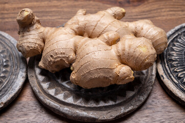 Fototapeta premium Fresh ginger rhizome root used in traditional medicines and for flavoring meals worldwide.