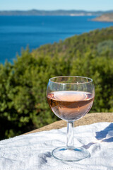 Picnic with of local rose wine and blue Mediterranean sea on background, near Saint-Tropez, Var, Provence, France